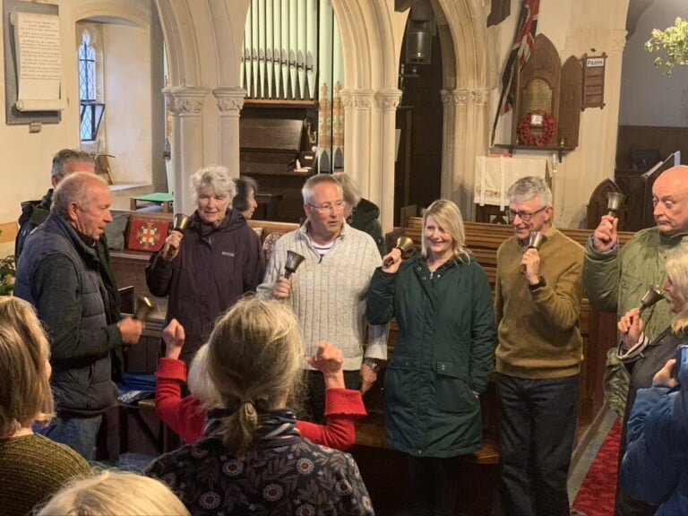 Shipton villagers ringing rounds on handbells for the King