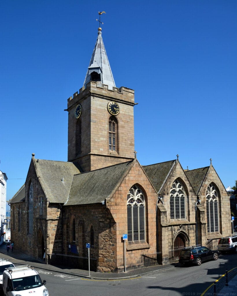 Town Church, St Peter Port, Guernsey. The clock bell is in the canopy in the lower part of the spire.