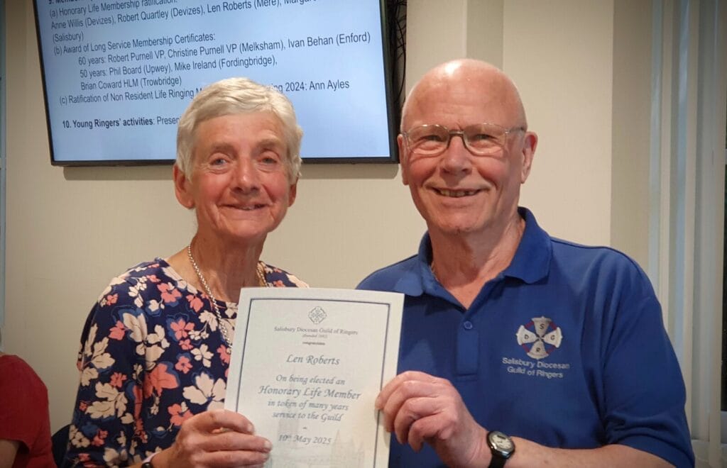 Len Roberts presented with his certificate of Honorary Life Membership by Pat Davidson