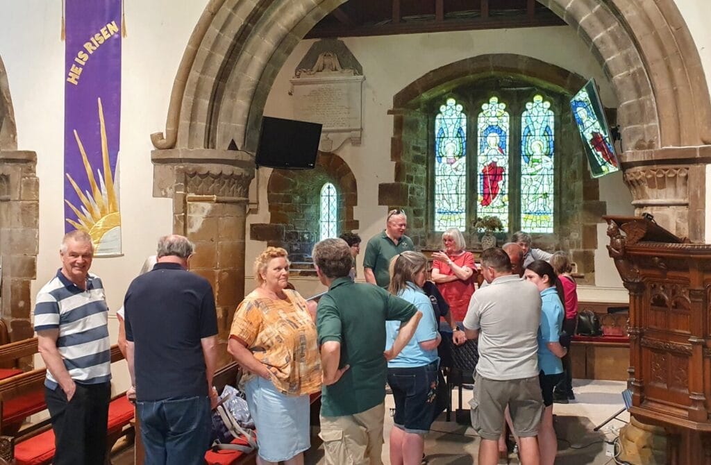 Ringers queueing in the church to ring at Canford Magna before the AGM