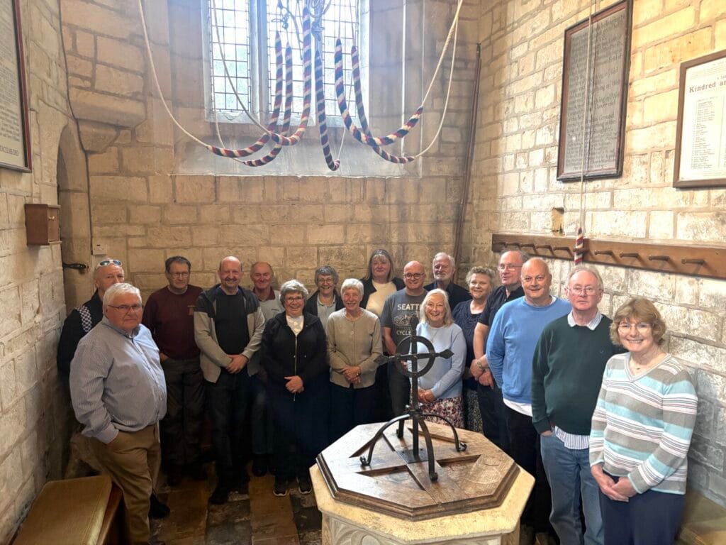 Calne Branch Spring Tower Tour group of people around the font