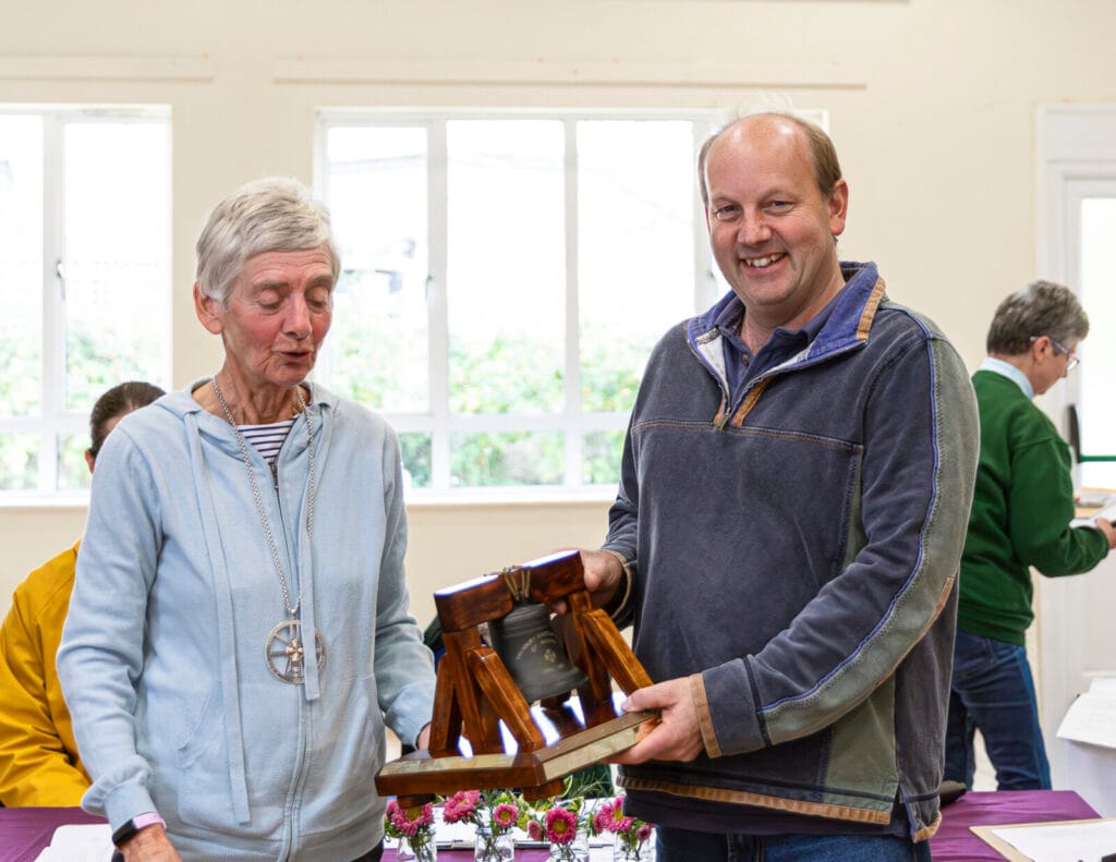 Nick Baker of the West Dorset team receiving the 6-bell Trophy from Guild President Pat Davidson