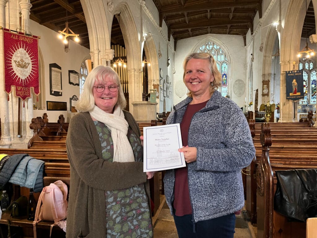 The Guild Master Vicki Rowse presenting Wyke Regis’ new member Helen Treacher with her certificate