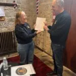 Christine Dolan presenting Ian Walker with his new member certificate