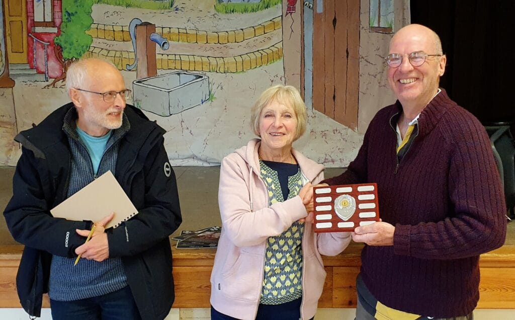 Judges Sue Carter and Jonathan Godfrey present the Greenings Shield to Andy Helm on behalf of the winning Toller Porcorum Novice team
