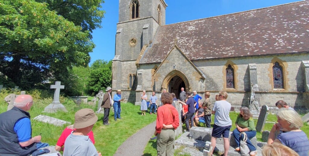 The announcement of the results outside in the sunshine of the churchyard