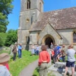 The announcement of the results outside in the sunshine of the churchyard