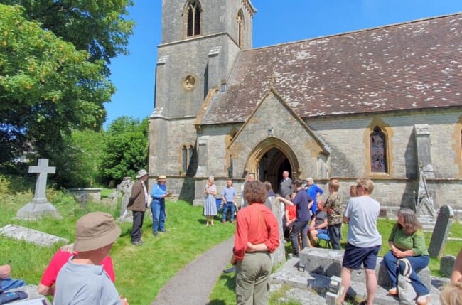 The announcement of the results outside in the sunshine of the churchyard