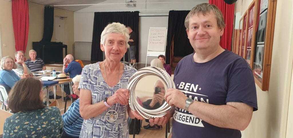 Ben Kipling of Trowbridge receiving the Guild Call Change Competition Plate from Guild President Pat Davidson