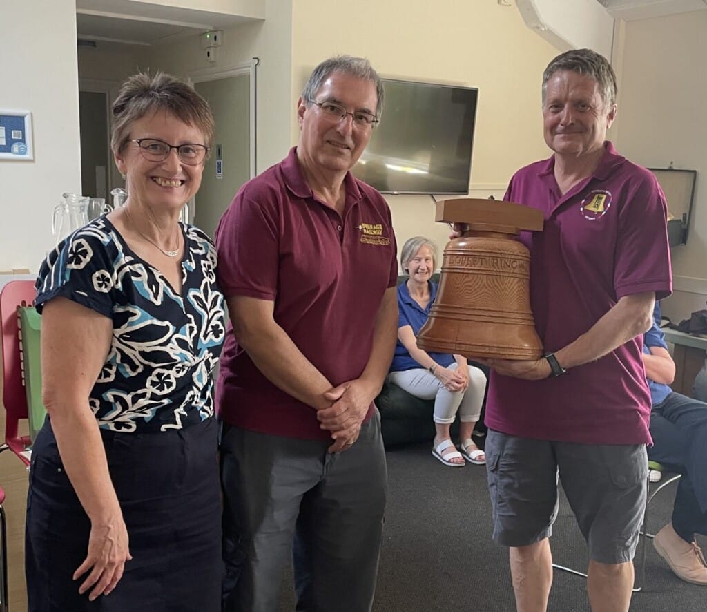 Chris Caryer and Liz Thornton present the trophy to Rob Child of Wimborne Minster