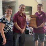 Chris Caryer and Liz Thornton present the trophy to Rob Child of Wimborne Minster