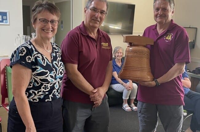 Chris Caryer and Liz Thornton present the trophy to Rob Child of Wimborne Minster